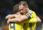 Sweden's Andreas Granqvist, right, hugs Marcus Berg at the end of the World Cup qualifying play-off second leg soccer match between Italy and Sweden, at the Milan San Siro stadium, Italy, Monday, Nov. 13, 2017. Four-time champion Italy has failed to qualify for World Cup; Sweden advances with 1-0 aggregate win in playoff. (AP Photo/Antonio Calanni)