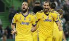Juventus' Gonzalo Higuain, left, celebrates with his teammate Giorgio Chiellini after scoring during a Champions League, Group D, soccer match between Sporting CP and Juventus at the Alvalade stadium in Lisbon, Tuesday, Oct. 31, 2017. (AP Photo/Armando Franca)