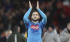 Napoli's Kostas Manolas applauds his side's fans after the Champions League Group E soccer match between Liverpool and Napoli at Anfield stadium in Liverpool, England, Wednesday, Nov. 27, 2019. (AP Photo/Jon Super)