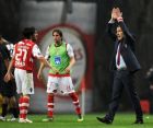 Sporting Braga's coach Leonardo Jardim, right, celebrates next to striker Nuno Gomes and Custodio Castro, left, after their victory over Academica Coimbra during their Portuguese League soccer match at the Municipal Stadium, in Braga, Portugal, Monday, March 26, 2012. Braga won 2-1 to lead the Portuguese championship, ahead of FC Porto and Benfica, with a 13th straight win.(AP Photo/Paulo Duarte)