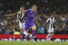 Juventus' Paulo Dybala challenges Real Madrid's Toni Kroos, right, during the Champions League final soccer match between Juventus and Real Madrid at the Millennium stadium in Cardiff, Wales Saturday June 3, 2017. (AP Photo/Dave Thompson)