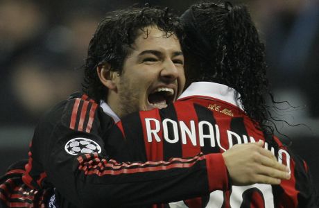 AC Milan Brazilian forward Ronaldinho, right, celebrates with teammate Pato after scoring during a Champions League, round of 16, first leg soccer match between AC Milan and Manchester United at the San Siro stadium in Milan, Italy, Tuesday, Feb. 16, 2010. (AP Photo/Alberto Pellaschiar)