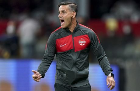FILE- Canada's coach John Herdman reacts during a qualifying soccer match against Mexico for the FIFA World Cup Qatar 2022 in Mexico City, on Oct. 7, 2021. Canada sits a top of CONCACAF standings for World Cup qualification, in front of the United States and Mexico. Along the way, the team has dramatically risen in the FIFA rankings from No. 94 when Herdman took over in 2018 to No. 33 today.   (AP Photo/Fernando Llano, File)