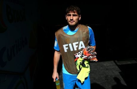CURITIBA, BRAZIL - JUNE 23:  Iker Casillas of Spain walks on to the pitch from the tunnel prior to the 2014 FIFA World Cup Brazil Group B match between Australia and Spain at Arena da Baixada on June 23, 2014 in Curitiba, Brazil.  (Photo by Ryan Pierse - FIFA/FIFA via Getty Images)