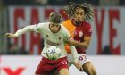 Manchester United's Alejandro Garnacho, left, challenges for the ball with Galatasaray's Sacha Boey during the Champions League group A soccer match between Galatasaray and Manchester United in Istanbul, Turkey, Wednesday, Nov. 29, 2023. (AP Photo)