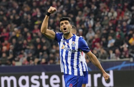 Porto's Mehdi Taremi celebrates after scoring during the Champions League Group B soccer match between Bayer Leverkusen and FC Porto at the BayArena in Leverkusen, Germany, Wednesday, Oct. 12, 2022. (AP Photo/Martin Meissner)