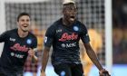 Napoli's Victor Osimhen, right, celebrates after scoring his side's opening goal during a Serie A soccer match between Roma and Napoli, at the Olimpic stadium in Rome, Sunday, Oct. 23, 2022. (AP Photo/Andrew Medichini)