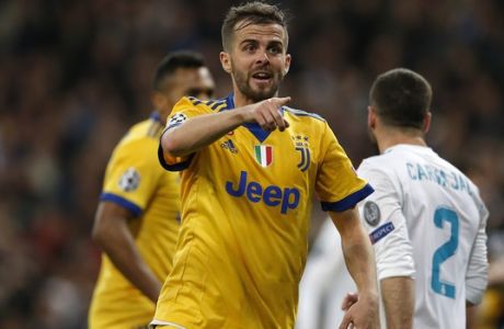 Juventus' Miralem Pjanic reacts during a Champions League quarter-final, 2nd leg soccer match between Real Madrid and Juventus at the Santiago Bernabeu stadium in Madrid, Spain, Wednesday, April 11, 2018. (AP Photo/Paul White)