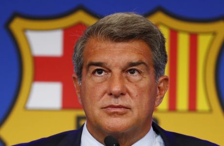 FILE - FC Barcelona club President Joan Laporta pauses during a news conference in Barcelona, Spain, on Aug. 6, 2021. Barcelona wont be able to reduce its salary burden to acceptable limits for the club until several veteran players finish their contracts, its top financial officer said Thursday, Oct. 6, 2022. (AP Photo/Joan Monfort, File)