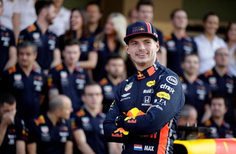 Red Bull driver Max Verstappen of the Netherland's poses during a team picture at the Yas Marina racetrack in Abu Dhabi, United Arab Emirates, Thursday, Nov. 28, 2019. The Emirates Formula One Grand Prix will take place on Sunday. (AP Photo/Luca Bruno)