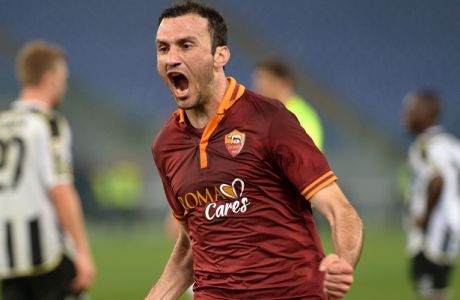 AS Roma's Greek defender Vasilis Torosidis celebrates after scoring during the Italian Serie A football  match between AS Roma and Udinese on March 17, 2014 at the Olympic stadium in Rome.  AFP PHOTO / GABRIEL BOUYS        (Photo credit should read GABRIEL BOUYS/AFP/Getty Images)