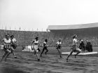 Fanny Blankers-Koen, right, of Holland, crosses the finish line in 11.9 seconds to win the Women's 100-meter Final in the Olympic Games at Wembley Stadium, London,. Aug. 2, 1948. Left to right;  Britain's Dorothy Manley, no. 691, was second; Canada's Pat Jones, finished fifth; Australia's Shirley Strickland,no. 668, finished third; Jamaica's E. Thompson, no.702 finished sixth; Canada's V. Myers, no.702 finished fourth; Blankers-Koen. (AP Photo)