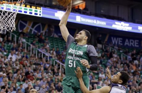 Boston Celtics' Abdel Nader (51) goes to the basket as Utah Jazz's Joel Bolomboy, left, Trey Lyles, center, and Marcus Paige (16) watch during the first half of an NBA summer league basketball game Tuesday, July 5, 2016, in Salt Lake City. (AP Photo/Rick Bowmer)
