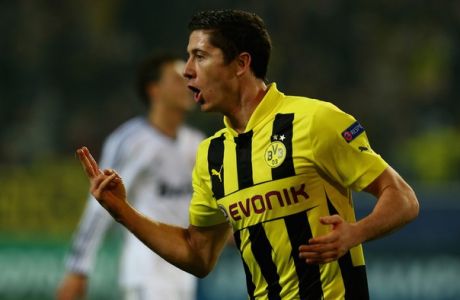 DORTMUND, GERMANY - OCTOBER 24:  Robert Lewandowski of Dortmund celebrates after he scores his team's opening goal during the UEFA Champions League group D match between Borussia Dortmund and Real Madrid at Signal Iduna Parkon October 24, 2012 in Dortmund, Germany.  (Photo by Martin Rose/Bongarts/Getty Images)