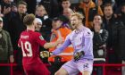 Liverpool goalkeeper Caoimhin Kelleher, right, celebrates with teammate Harvey Elliott after the English League Cup soccer match between Liverpool and Derby County, at Anfield Stadium, in Liverpool, England, Wednesday, Nov. 9, 2022. (AP Photo/Jon Super)