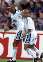 Nicolas Anelka, left, and Roberto Carlos of Real Madrid soccer club celebrate the 1-1 by Anelka vs FC Bayern Munich in their UEFA Champions League semifinal second leg match in Munich's Olympic stadium, Tuesday, May 9, 2000. (AP Photo/Camay Sungu)