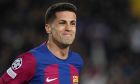 Barcelona's Joao Cancelo celebrates after scoring his side's second goal during the Champions League, round of 16, second leg soccer match between Barcelona and SSC Napoli at the Olympic Lluis Companys stadium in Barcelona, Spain, Tuesday, March 12, 2024. (AP Photo/Emilio Morenatti)