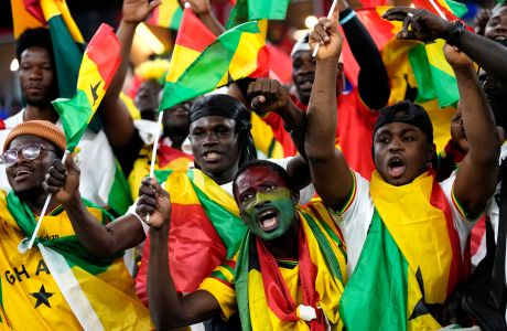 Fans of Ghana cheer prior the start of the World Cup group H soccer match between Portugal and Ghana, at the Stadium 974 in Doha, Qatar, Thursday, Nov. 24, 2022. (AP Photo/Darko Bandic)