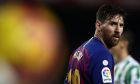 FILE - In this Sunday, Nov. 11, 2018 file photo, FC Barcelona's Lionel Messi looks on during the Spanish La Liga soccer match between FC Barcelona and Betis at the Camp Nou stadium in Barcelona, Spain. A young Afghan soccer fan who shot to fame after he was photographed in a Messi shirt made from a plastic bag has been forced to flee with his family to the Afghan capital after criminal gangs and the Taliban threatened to kill or kidnap him. Shafiqa Ahmedi said Friday, Dec. 7, 2018 that criminals threatened to kidnap her now-7-year-old son Murtaza, a fan of Argentinian soccer star Lionel Messi, after demanding money. (AP Photo/Manu Fernandez, file)