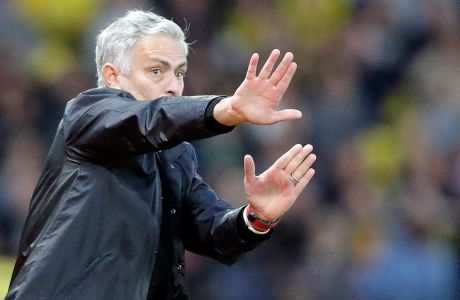 Manchester United head coach Jose Mourinho gestures during the English Premier League soccer match between Watford and Manchester United at Vicarage Road stadium in Watford, England, Saturday, Sept. 15, 2018.(AP Photo/Frank Augstein)