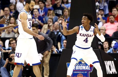 Mar 26, 2016; Louisville, KY, USA; Kansas Jayhawks guard Devonte' Graham (4) reacts to a call during the second half against the Villanova Wildcats in the south regional final of the NCAA Tournament at KFC YUM!. Mandatory Credit: Aaron Doster-USA TODAY Sports