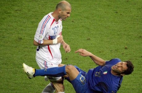 A photo taken 09 July 2006 shows French midfielder Zinedine Zidane (L) gesturing after head-butting Italian defender Marco Materazzi during the World Cup 2006 final football match between Italy and France at Berlin?s Olympic Stadium.  AFP PHOTO  JOHN MACDOUGALL (Photo credit should read JOHN MACDOUGALL/AFP/Getty Images)