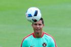 Portugal's Christiano Ronaldo exercises with the ball during a training session in Marcoussis, near Paris, France, Monday, July 4, 2016. Portugal will face Wales in a Euro 2016 semi final soccer match in Lyon on Wednesday, July 6, 2016. (AP Photo/Thibault Camus)
