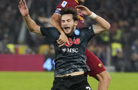 Napoli's Khvicha Kvaratskhelia, front, duels for the ball with Roma's Lorenzo Pellegrini during a Serie A soccer match between Roma and Napoli, at the Olimpic stadium in Rome, Sunday, Oct. 23, 2022. (AP Photo/Andrew Medichini)