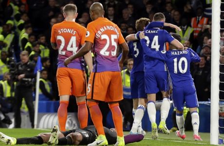 Chelsea players celebrate after Eden Hazard, right, scored their second goal during the English Premier League soccer match between Chelsea and Manchester City at the Stamford Bridge stadium in London, Wednesday, April 5, 2017. (AP Photo/Alastair Grant)