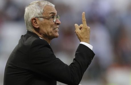Egypt head coach Hector Cuper gestures to his players during the group A match between Saudi Arabia and Egypt at the 2018 soccer World Cup at the Volgograd Arena in Volgograd, Russia, Monday, June 25, 2018. (AP Photo/Andrew Medichini)