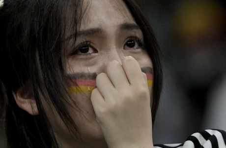 A soccer fan supporting Germany reacts at the end of the World Cup group E soccer match between Costa Rica and Germany at the Al Bayt Stadium in Al Khor , Qatar, Friday, Dec. 2, 2022. (AP Photo/Hassan Ammar)