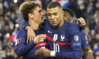 France's Antoine Griezmann celebrates with France's Kilian Mbappe after scoring a penalty, his side's seventh goal, during the World Cup 2022 group D qualifying soccer match between France and Kazakhstan at the Parc des Princes stadium in Paris, France, Saturday, Nov. 13, 2021. (AP Photo/Michel Euler)