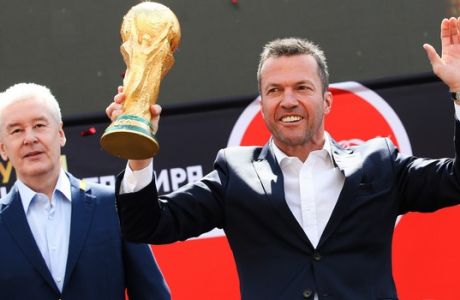 Moscow Mayor Sergei Sobyanin, left, and former German soccer star Lothar Matthaus, attend a ceremony to welcome the FIFA World Cup trophy at Manezh Square in Moscow, Russia, Sunday, June 3, 2018. (Kirill Zykov/Moscow News Agency photo via AP)