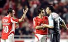 Benfica's Karagounis, left, from Greece, argues with Braga's Joao Tomas, as Nuno Gomes pulls them apart at the end of their Portuguese league soccer match Saturday, March 25 2006, at Benfica's Luz stadium in Lisbon, Portugal. Benfica defeated Braga 1-0. (AP Photo/Armando Franca)