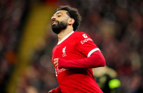Liverpool's Mohamed Salah reacts after scoring his side's third goall during the Europa League round of 16, second leg, soccer match between Liverpool and Sparta Praha at Anfield Stadium, Liverpool, England, Thursday March 14, 2024. (AP Photo/Jon Super)
