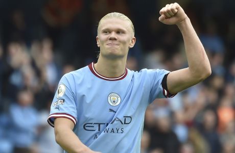 Manchester City's Erling Haaland celebrates at the end of the English Premier League soccer match between Manchester City and Manchester United at Etihad stadium in Manchester, England, Sunday, Oct. 2, 2022. (AP Photo/Rui Vieira)