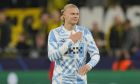 Manchester City's Erling Haaland applauds fans at the end of the Champions League Group G soccer match between Borussia Dortmund and Manchester City in Dortmund, Germany, Tuesday, Oct. 25, 2022. (AP Photo/Martin Meissner)