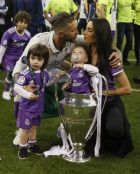 Real Madrid's Sergio Ramos poses with the trophy and his family after the Champions League soccer final between Juventus and Real Madrid at the Millennium Stadium in Cardiff, Wales, Saturday, June 3, 2017. Real Madrid won the cup. (AP Photo/Kirsty Wigglesworth)