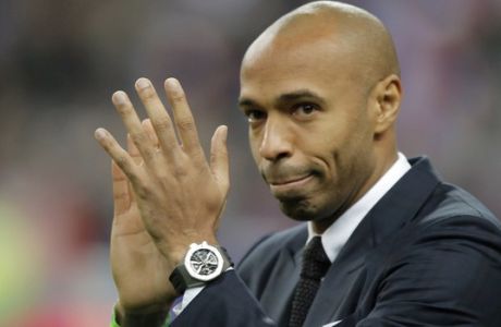 FILE - This is a Thursday, March 26, 2015, file photo of former France's soccer player Thierry Henry as he acknowledges applause prior to the international friendly soccer match between France and Brazil at the Stade de France, north of Paris. It was announced Friday Aug. 26, 2016, that Henry will be become an  assistant  to new Belgium national soccer team manager Roberto Martinez. (AP Photo/Francois Mori, File)