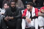 Houston Rockets guard James Harden, left, and guard Michael Carter-Williams watch the game action during the first half of an NBA basketball game against the Brooklyn Nets, Friday, Nov. 2, 2018, in New York. (AP Photo/Mary Altaffer)