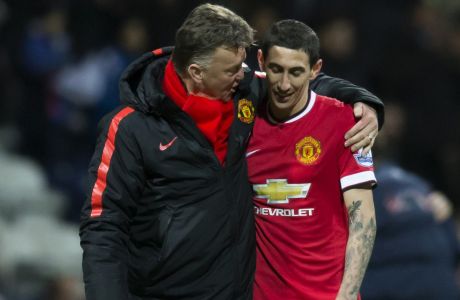 Manchester United's manager Louis van Gaal, left, speaks with Angel Di Maria during the English FA Cup Fifth Round soccer match between Preston and Manchester United at Deepdale Stadium in Preston, England, Monday Feb. 16, 2015.  (AP Photo/Jon Super)