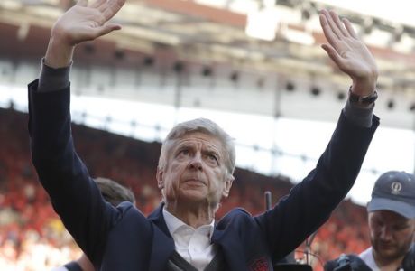 Arsenal's French manager Arsene Wenger waves during a lap of honor after the match between Arsenal and Burnley at the Emirates Stadium in London, Sunday, May 6, 2018. The match is Arsenal manager Arsene Wenger's last home game in charge after announcing in April he will stand down as Arsenal coach at the end of the season after nearly 22 years at the helm. (AP Photo/Matt Dunham)