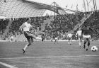 Poland's Grzegorz Lato hits the ball oast Haitian defender Wilner Nazaire, to score his team's first goal in the World Cup Finals match in Munich, West Germany, June 19, 1974. Poland defeated Haiti by seven goals to nil.  (AP Photo/Staff)