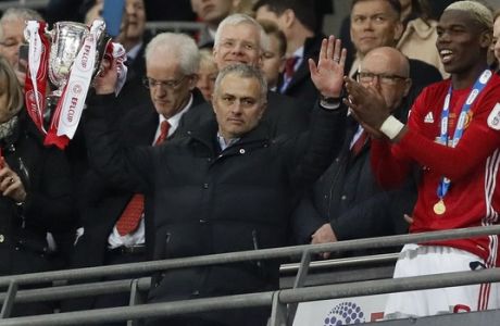 United manager Jose Mourinho lifts the trophy after they won the English League Cup final soccer match between Manchester United and Southampton FC at Wembley stadium in London, Sunday, Feb. 26, 2017. (AP Photo/Kirsty Wigglesworth)