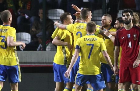 Sweden players celebrate their side's 3rd goal during the international friendly soccer match between Portugal and Sweden at the dos Barreiros stadium in Funchal, Madeira island, Portugal, Tuesday, March 28 2017. (AP Photo/Armando Franca)