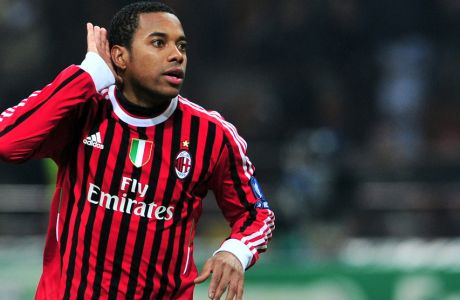 Robinho of AC Milan celebrates scoring the second goal during the UEFA Champions League round of 16 first leg against Arsenal FC