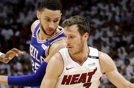 Miami Heat guard Goran Dragic (7) is defended by Philadelphia 76ers guard Ben Simmons (25) during the third quarter in Game 4 of a first-round NBA basketball playoff series Saturday, April 21, 2018, in Miami. The 76ers won 106-102. (AP Photo/Joe Skipper)