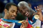 USA's Vince Carter, left, and Kevin Garnett show off their gold medals during the awards ceremony for mens basketball at the 2000 Summer Olympic Games in Sydney, Sunday Oct. 1, 2000.  The United States defeated France 85-75 to capture the gold. (AP Photo/Roberto Borea)