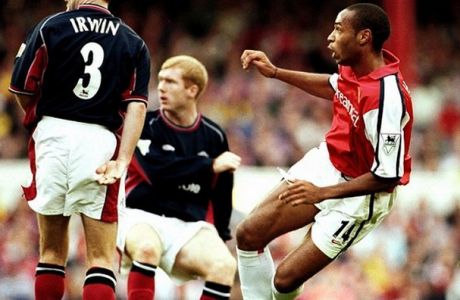 Arsenal's Thierry Henry scores the first goal of the game against Man Utd