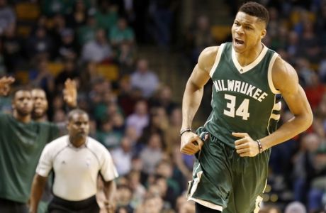 Milwaukee Bucks forward Giannis Antetokounmpo (34) reacts after hitting a three-point shot during the first half of an NBA basketball game against the Boston Celtics, Wednesday, March 29, 2017, in Boston. (AP Photo/Mary Schwalm)